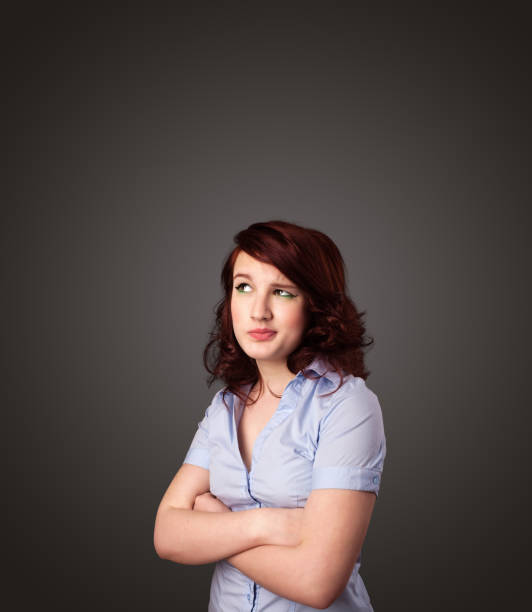 istock Young woman thinking with copy space 912384650