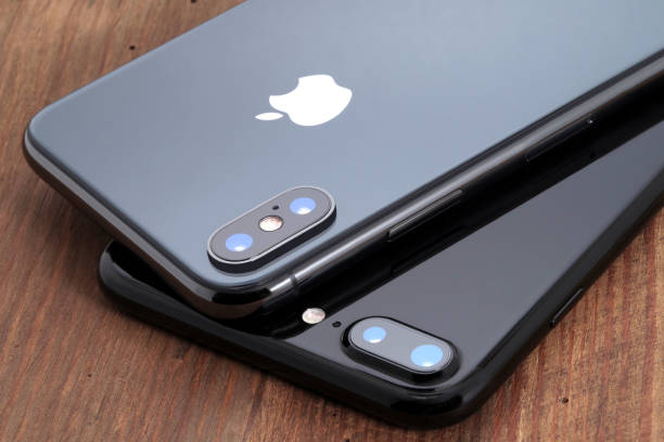 Space gray iPhone X and black iPhone 7. Koszalin, Poland – November 29, 2017: Space gray iPhone X and black iPhone 7. The iPhone X and iPhone 7 is smart phone with multi touch screen produced by Apple Computer, Inc. apple computer stock pictures, royalty-free photos & images