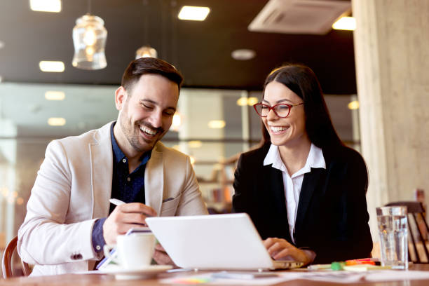 two young businessman having a successful meeting at restaurant. - couple laptop computer digital tablet imagens e fotografias de stock