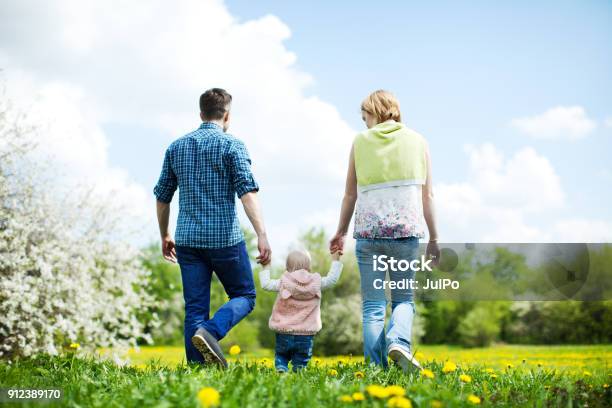 Happy Family Outdoors Stock Photo - Download Image Now - Child, Holding, Family