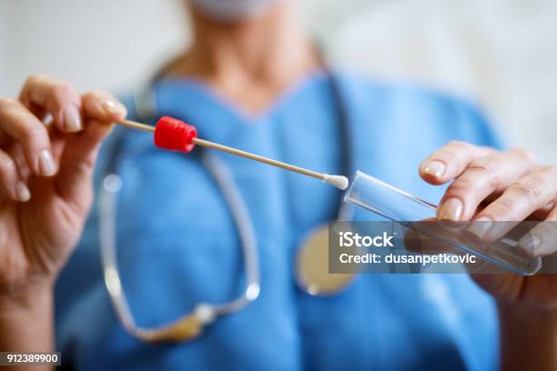 Close Up Of Nurses Hands Holding Buccal Cotton Swab And Test Tube Ready To Collect Dna From The Cells Stock Photo - Download Image Now