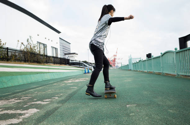 istock A woman riding a skateboard. 912392570