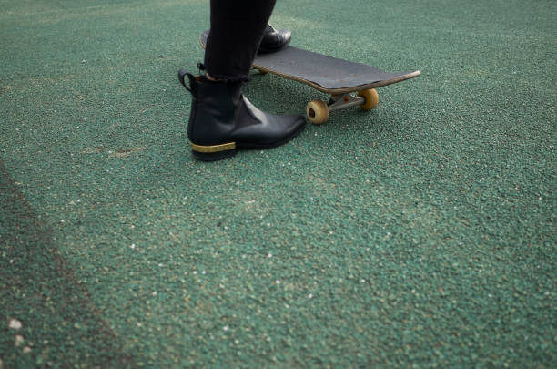 A woman riding a skateboard.