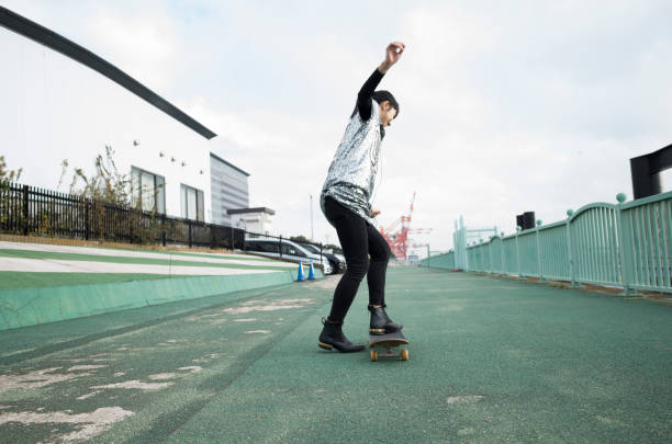 istock A woman riding a skateboard. 912392598