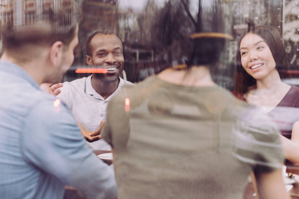 istock Young four friends talking about their lives 912399718