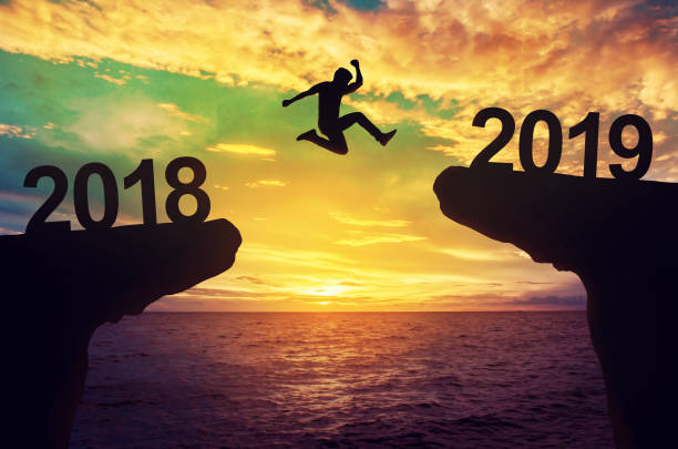 A man jump between 2018 and 2019 years. A man jump between 2018 and 2019 years. 2018 stock pictures, royalty-free photos & images