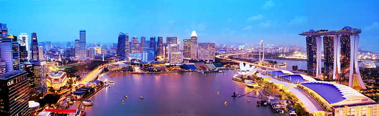 SINGAPORE - JANUARY 12, 2018: Panorama of Singapore city skyline at sunset, aerial view. Singapore business district with skyscrapers at twilight. Popular travel destination.