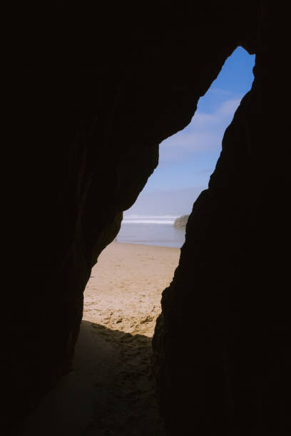 istock Sand beach visible from tight cave on Hug Point, Oregon, USA 912405192