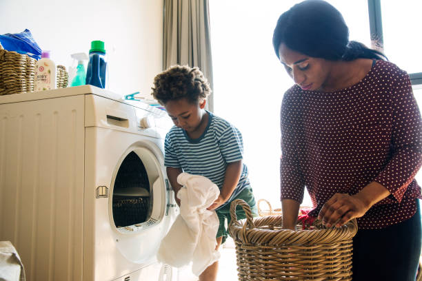 istock Mother and son doing housework together 912412154
