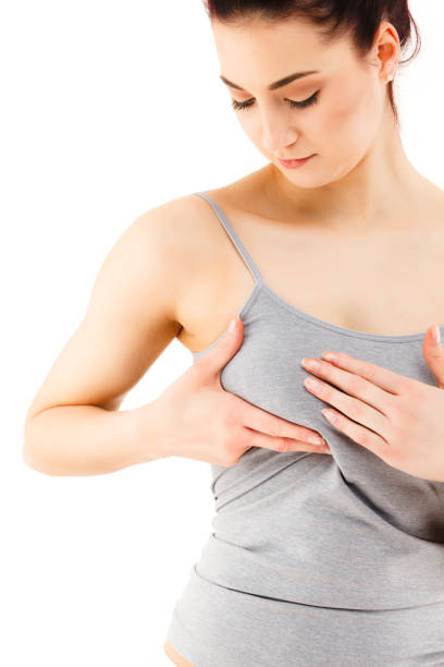 istock Woman examining her breast on white background 912412452