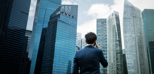 asian businessman in a city - hong kong city urban scene building exterior imagens e fotografias de stock