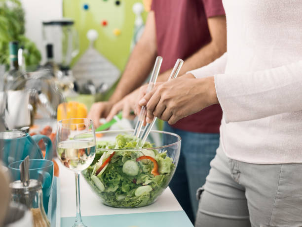 istock Couple cooking together in the kitchen 912413140