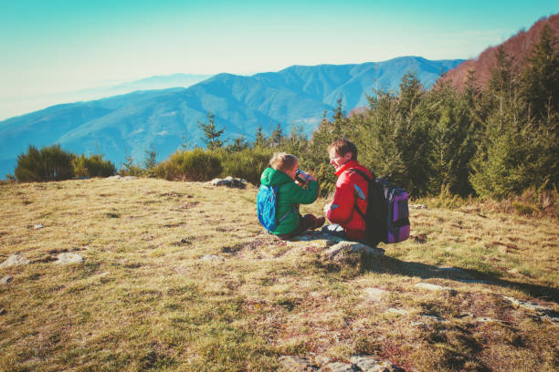 istock father and little son travel in mountains 912414064
