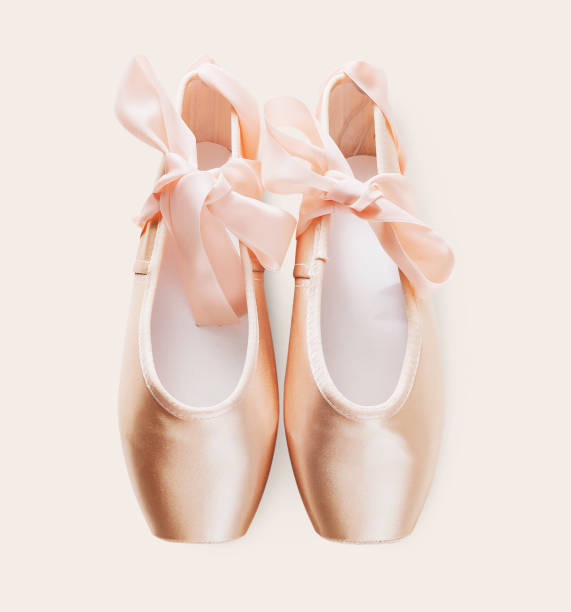 Pink ballet pointe shoes on white isolated background Pastel pink ballet shoes background. New pointe shoes with satin ribbon lay on white isolated backdrop flat shoe photos stock pictures, royalty-free photos & images