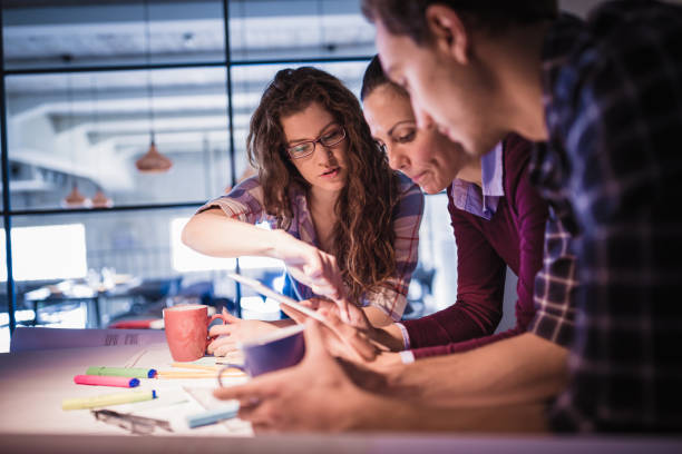 istock Female leaders. Group of young architects working together in architecture studio 912417374