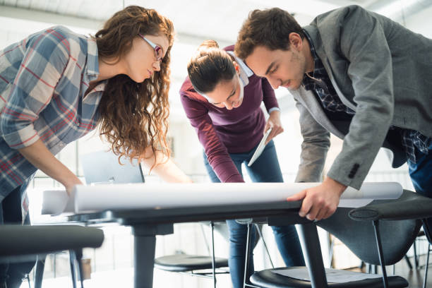 istock Female leaders. Group of young architects working together in architecture studio 912417542