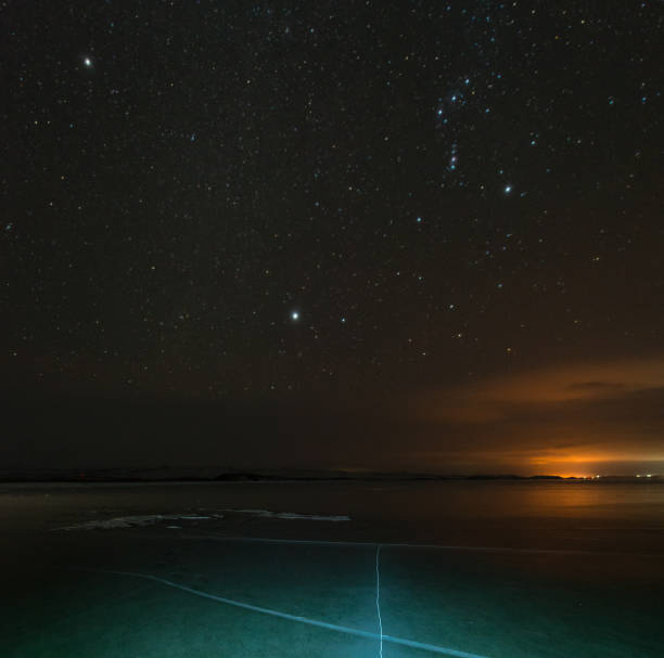 istock Starry sky over crack Baikal ice 912421838