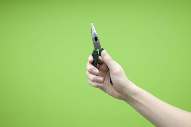 istock A hand holding a Long Nose Pliers on isolated background 912422152