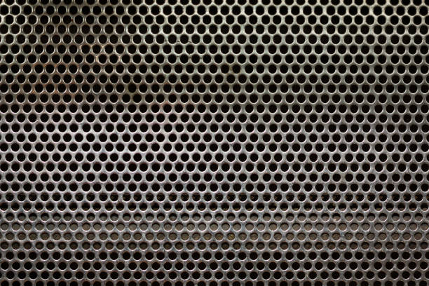 istock Full frame perforated steel plate for use as background 912425932