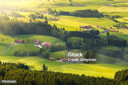 istock Lovely rural countryside in beautiful sunlight. Pasture landscape with barnyards. 912426620