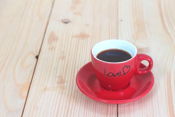 istock Red coffee cup on wood plate , valentine day concept. 912426882