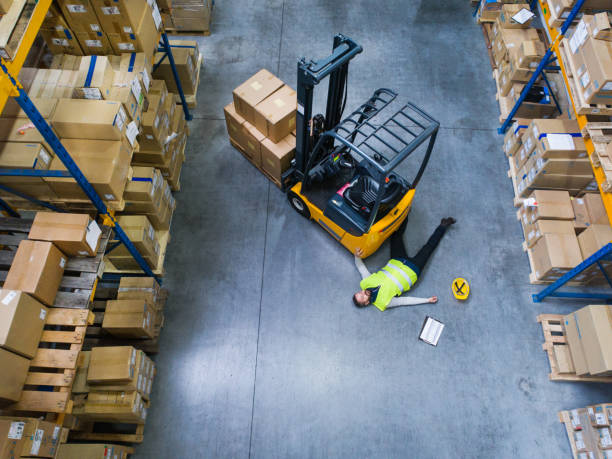 istock Warehouse worker after an accident in a warehouse. 912427174