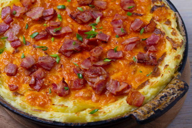 istock Cheddar Mashed Potato Casserole with Bacon. Baked Cheddar Potato Casserole 912429530