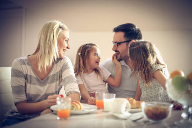istock Happy family having breakfast. 912430678