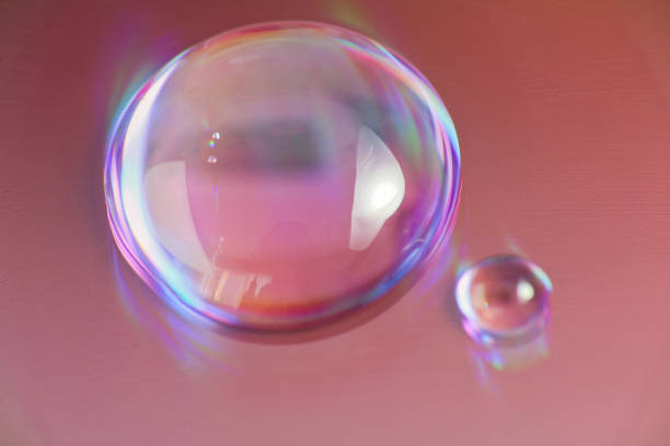 istock Two drops of water on shine background, macro photo 912433548