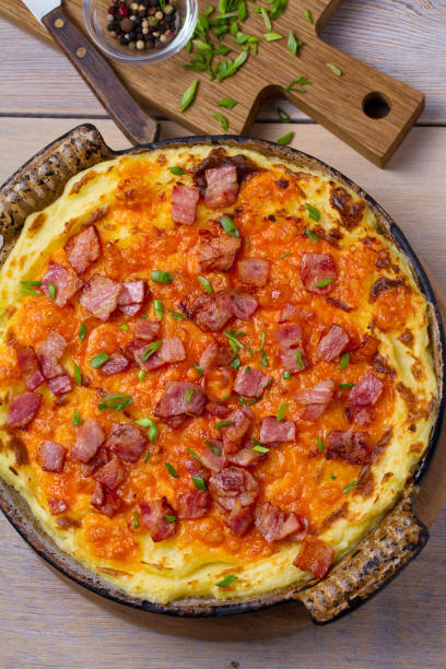 istock Cheddar Mashed Potato Casserole with Bacon. Baked Cheddar Potato Casserole 912433896