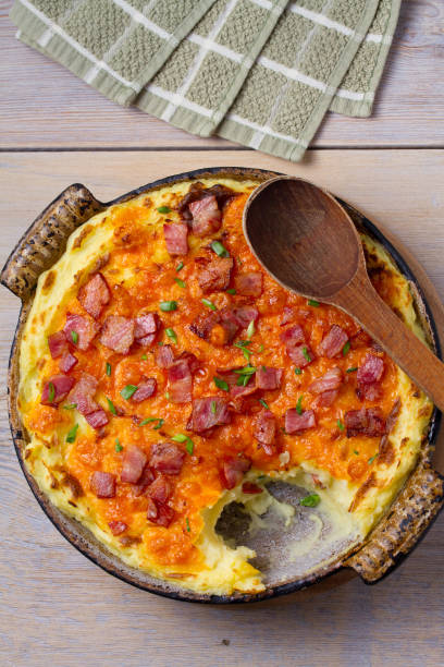 istock Cheddar Mashed Potato Casserole with Bacon. Baked Cheddar Potato Casserole 912437528