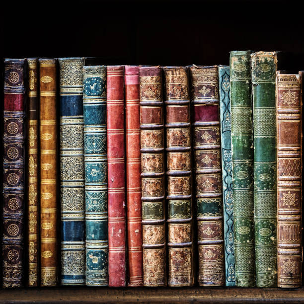 istock Old books on wooden shelf. 912438632