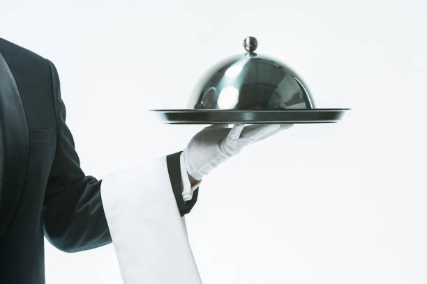 close up waiter hand with tray and metal cloche lid cover - tray glove butler white imagens e fotografias de stock