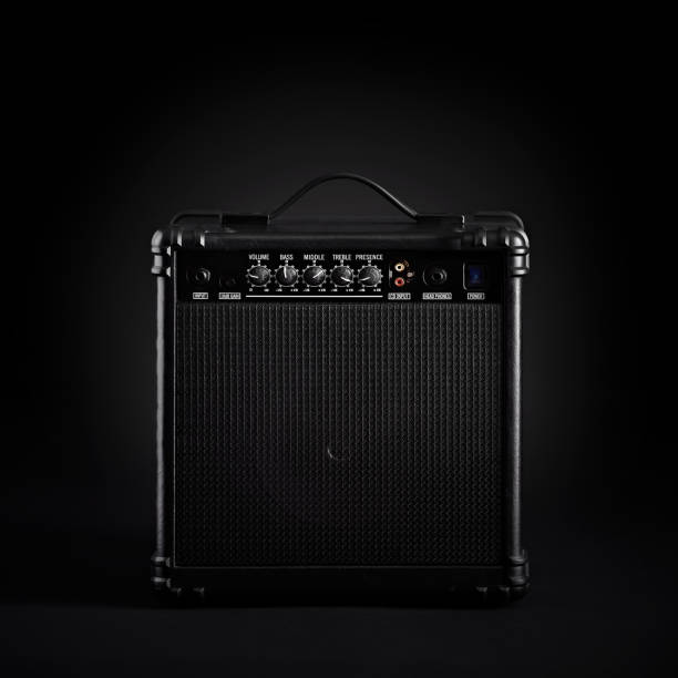 istock Black bass guitar amplifier on black background 912442454
