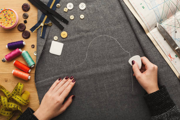 istock Top view on fashion designer working at messy table 912442980