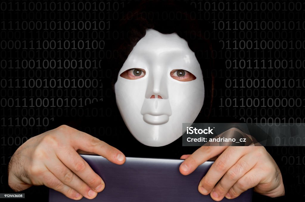 Portrait of anonymous man with white mask isolated on black Portrait of anonymous man with white mask isolated on black background Activist Stock Photo