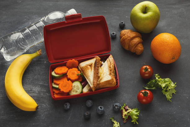 istock Lunch box with healthy food on black table background 912443796
