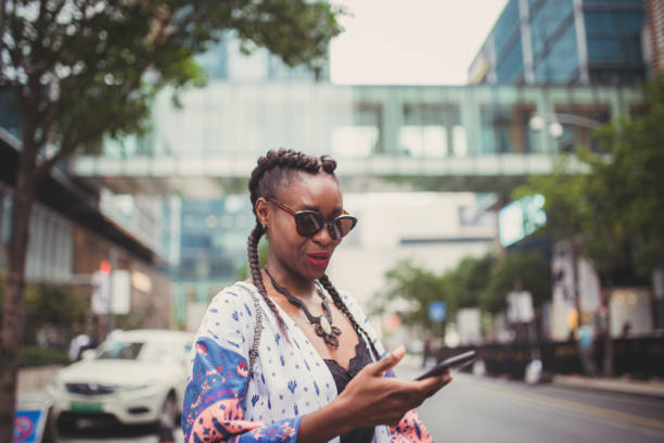 istock Woman using mobile on the street 912446580