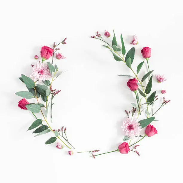 Photo of Flowers wreath on white background. Flat lay, top view
