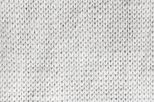 Macro photo of white knitted wool
