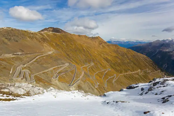 Photo of Hairpin turns of mountain pass (Stelvio Pass) named Stilfser Joch in Deutsch, in Italy