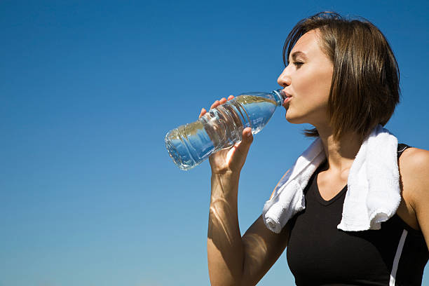istock Caucasian girl drinking water after exercise 91245519