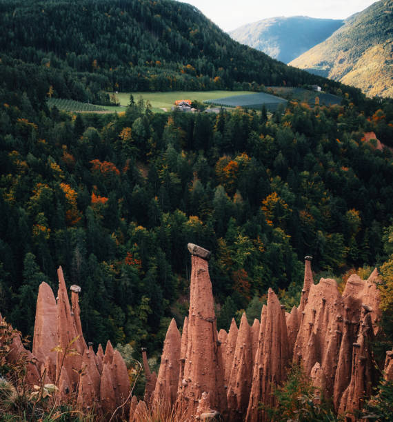 Earth pyramids with stones on top in Renon Ritten region, South Tyrol, Italy.