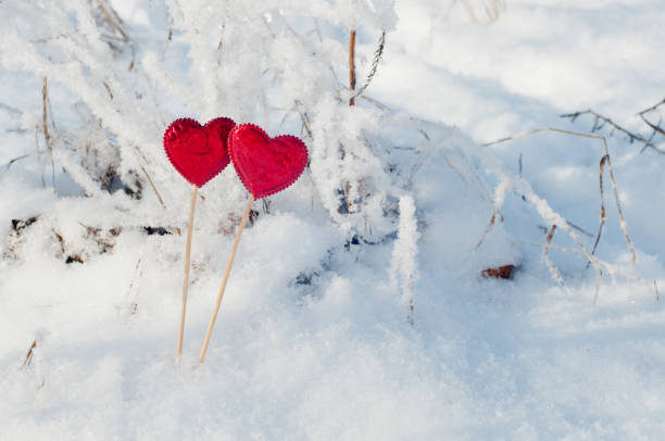 istock Copy space. Nice red hearts in winter snow. 912462996