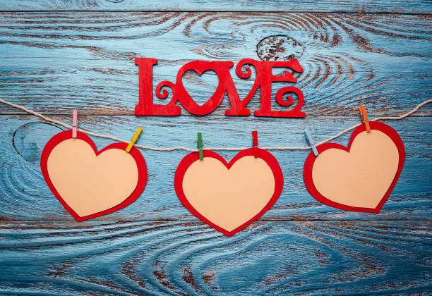 istock Valentines day background decorated with red hearts and love card/copy space 912468582