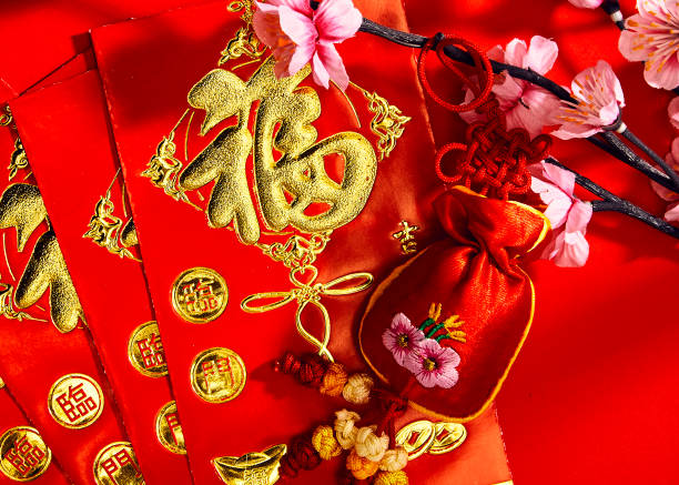 istock Plum blossom with red envelope and red cloth bag, chinese fetish (foreign message means blessing) 912474246