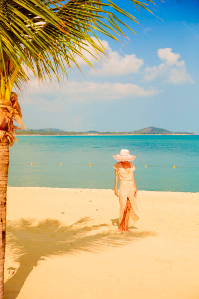 istock Woman at tropical beach 912475014