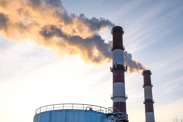 istock thick smoke belching from factory chimneys 912481372