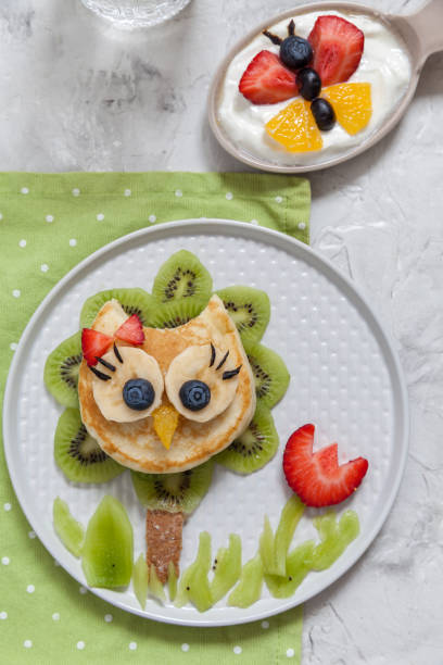 istock Cute owl pancake with fruits for kids breakfast 912481634