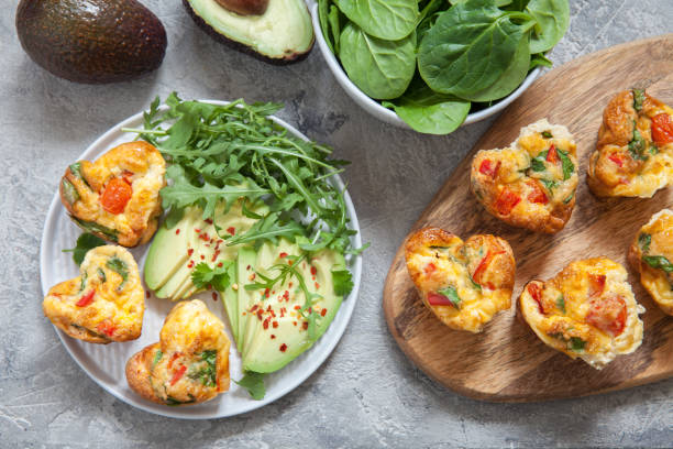 istock Delicious egg muffins with ham, cheese and vegetables 912482534